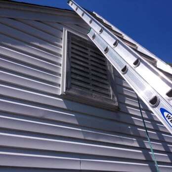 BEDR ladder set to a gable vent to install wildlife exclusion on a Virginia home